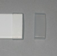 White plastic end caps for flat bottom bar. 